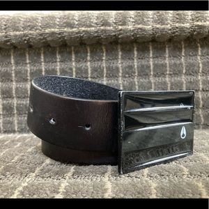 Black Nixon buckle with brown leather belt